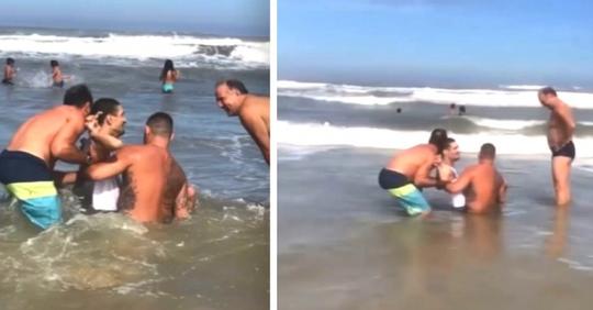 Zwei Badende helfen einem behinderten jungen Mann und seinem Vater, im Meer zu baden: Ein wahr gewordener Traum