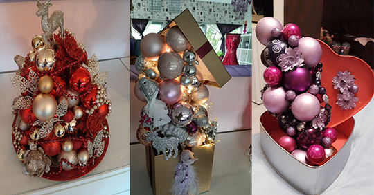 Mit einer Klebepistole und Weihnachtskugeln kreieren Sie in diesem Jahr die schönsten Dekorationen.